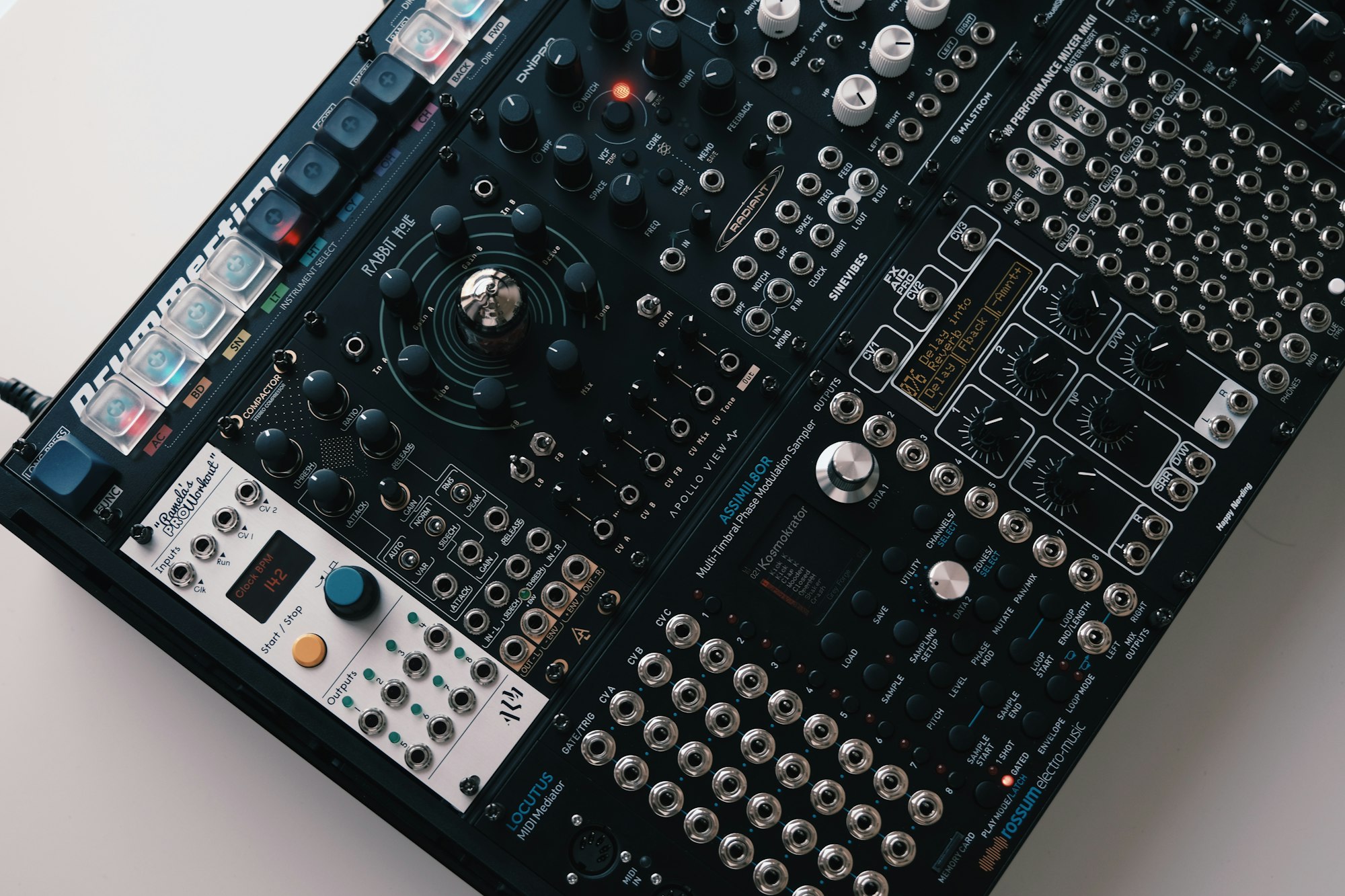 A modular synthesizer panel dense with knobs, ports and patch points
